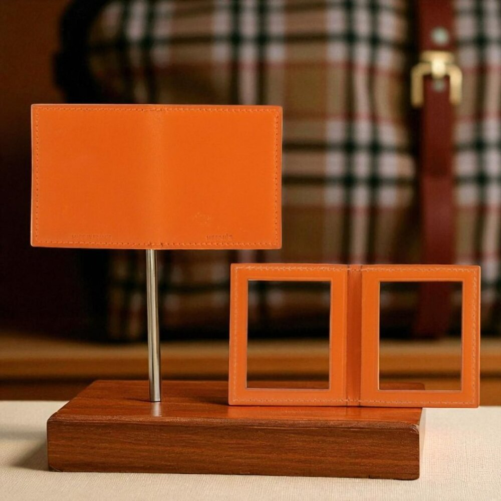 Hermès orange leather mini bi-fold 2 photo holder.